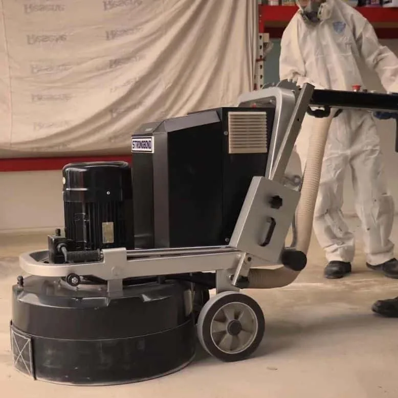 Concrete grinding equipment preparing an Auckland floor